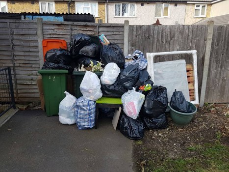 Professional sofa removal in Richmond with a bulky couch being collected