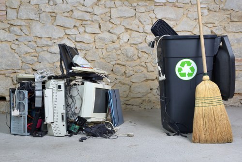 Waste removal crew inspecting mixed items before collection